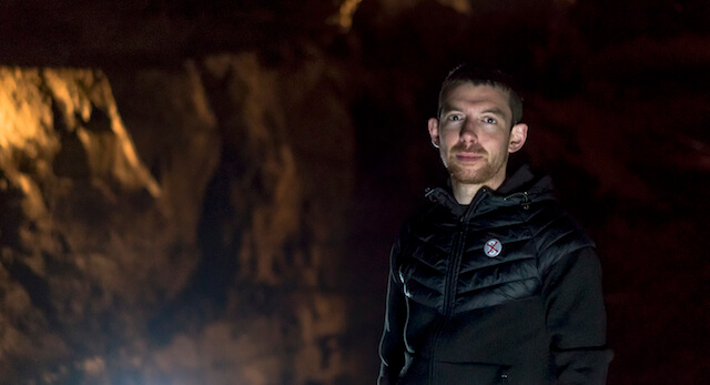Alan-James Burns profile picture in a cave