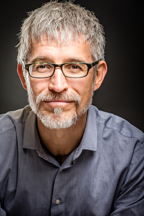 Jeffrey Davis profile picture grey shirt glasses smiling
