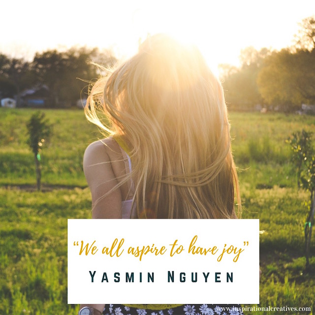 Blonde girl with long hair facing away towards sunshine overlooking green field text quote we all aspire to have joy by yasmin nguyen